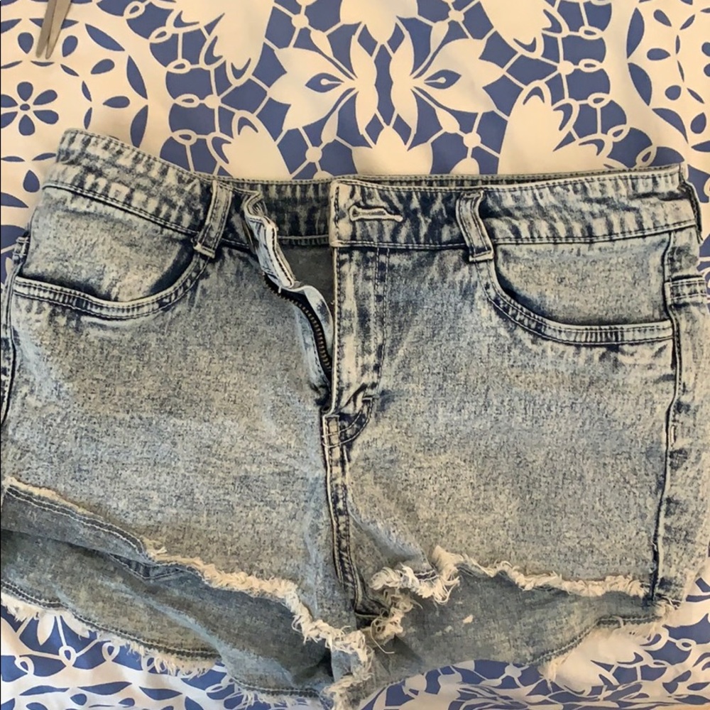 blue and white colored jean shorts